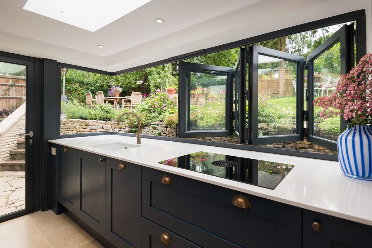 Bi-fold window in commercial servery use — pub bar / hospitality